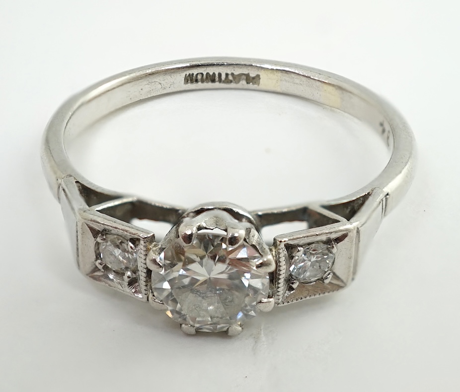 A 1920's/1930's platinum and single stone diamond set ring, with two stone diamond set shoulders